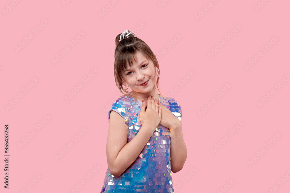 Beautiful girl in festive attire made a very cute face and looks into the camera Beautiful girl in festive attire made a very cute face and looks into the camera
