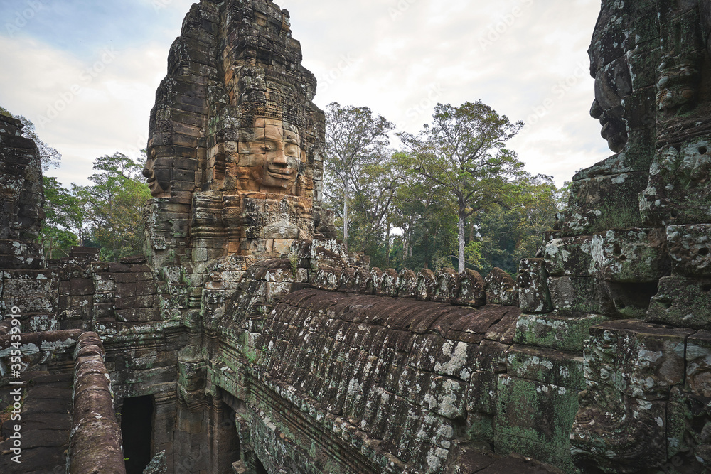 Fototapeta premium Bayon khmer temple with smiling stone faces at Angkor Wat complex in Cambodia