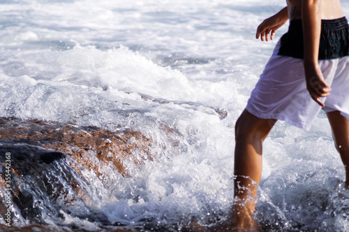 young woman running in the water