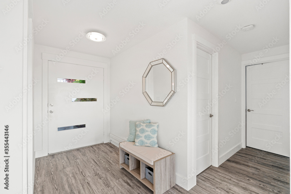 Beautiful white hallway interior with grey hardwood floors Beautiful white hallway interior with grey hardwood floors