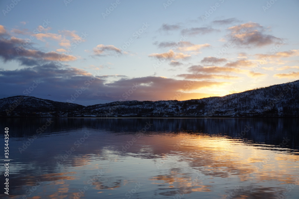 Norwegian fjord during sunset.