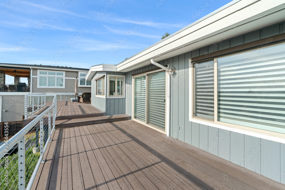 Spacious second floor deck with outdoor furniture and blue sky Spacious second floor deck with outdoor furniture and blue sky