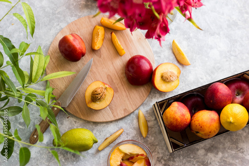 nectarine on the cutting Board in the kitchen. fresh fruit on the table in the drawer