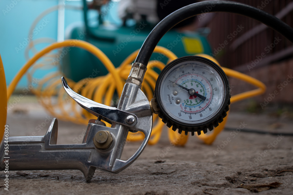 Air compressor gun with manometer ,Garage Air Compressor. Adjusting Pressure in a Car Tires,The