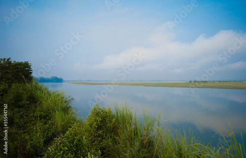 Landscape of lake and river in the morning time with fog at Kaziranga national park, Assam, India.
