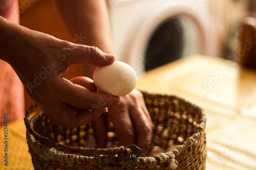 Unrecognizable person taking eggs