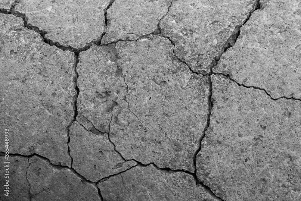 Fototapeta premium Cracked concrete texture closeup. Abstract cement background.