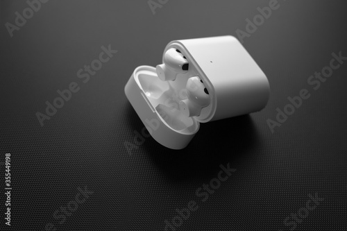 wireless headphones on a black matte background photo