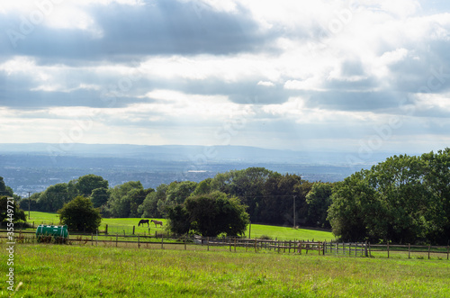 A countryside farm in the Cotswold District in Gloucestershire. Photo taken from the Cotswold Way.