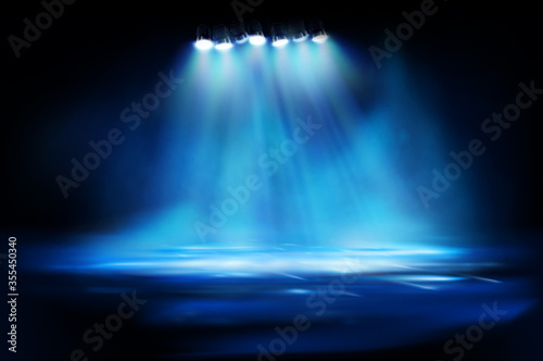 Fototapeta Naklejka Na Ścianę i Meble -  Brightly lit street lamps in the fog. Show on stage. City at night. Spotlights on blue background. Vector illustration.