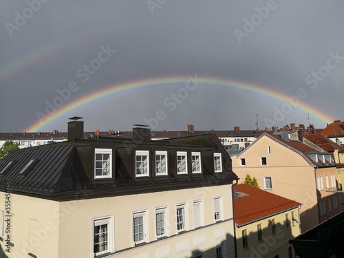 a beautiful rainbow stretches over munich