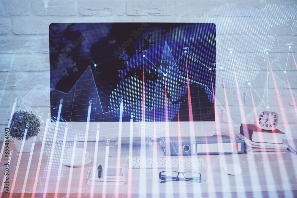 Forex graph hologram on table with computer background. Double exposure. Concept of financial markets. Forex graph hologram on table with computer background. Double exposure. Concept of financial markets.