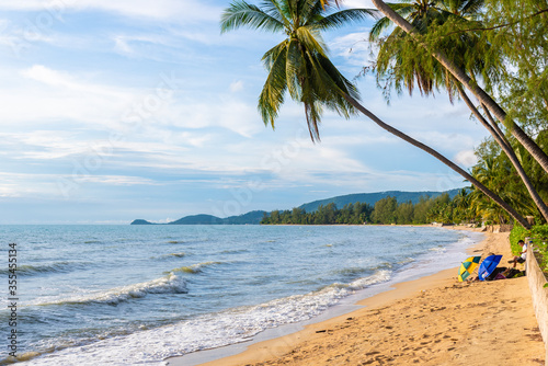 beach on Koh Samui in Thailand, paradise, sunny beach, coconuts and palm trees, sunbathing and swimming in the sea, blue ocean and sky, travel to the resort, relaxation and enjoyment
