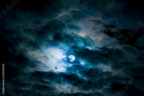 Night moon behind the dark clouds © Patrycja