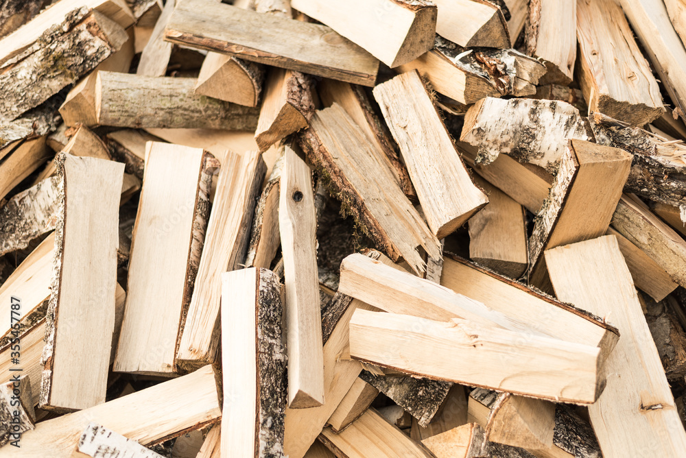 Dry split birch wood for the fireplace, stove, fire. Harvesting firewood for the winter. Texture for background. Dry split birch wood for the fireplace, stove, fire. Harvesting firewood for the winter. Texture for background.