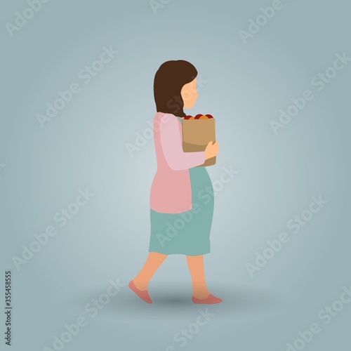 pregnant woman holding fruit packet