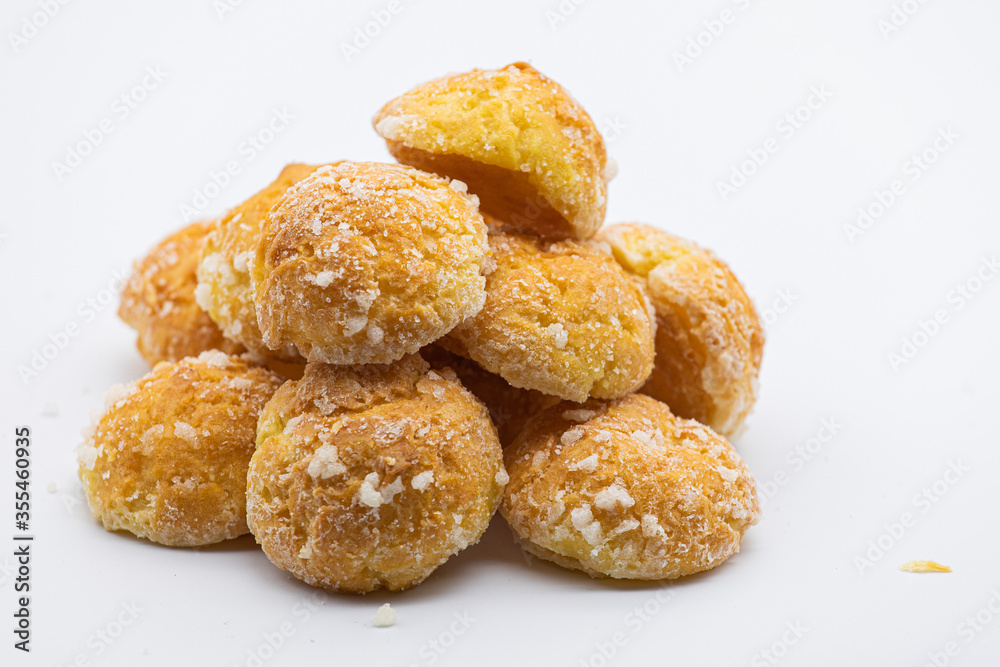 Sweet little bread with sugar on white background