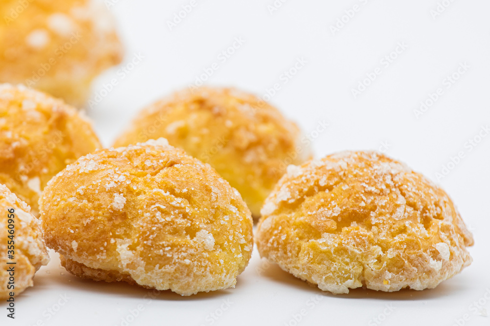 Sweet little bread with sugar on white background