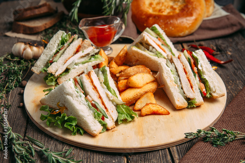 Sandwiches set with red sauce rustic potato wedges
