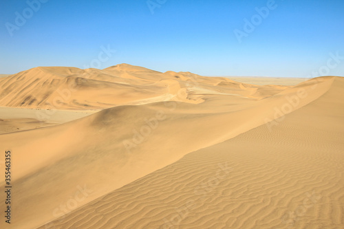 Big sand dunes panorama. Desert and coastal beach sand landscape scenery. Abstract background.