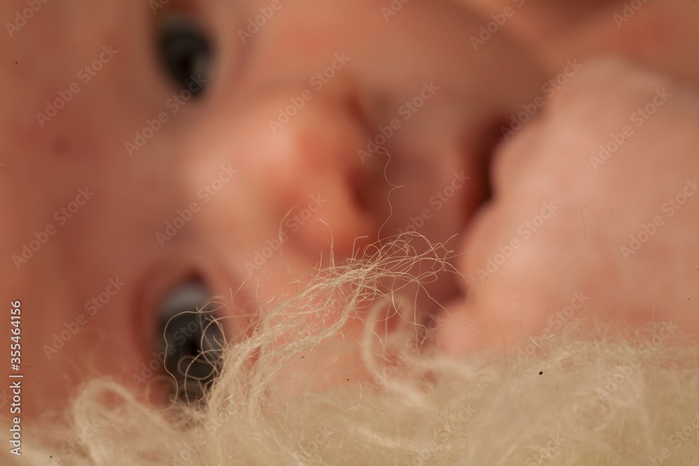 Close up Portrait of a beautiful little newborn baby with shallow depth of field