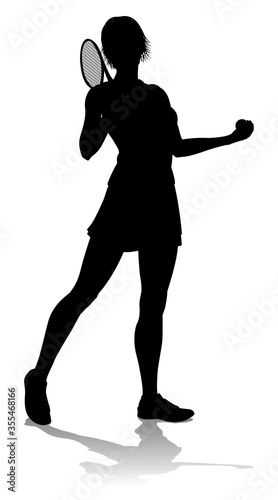 A tennis player woman female sports person in silhouette photo