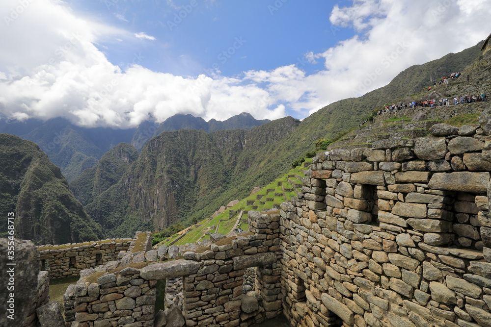 The detail of Inca buildings in the ancient city of Machu Picchu in Peru	