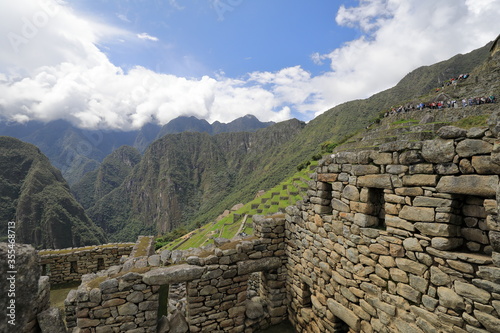 The detail of Inca buildings in the ancient city of Machu Picchu in Peru 