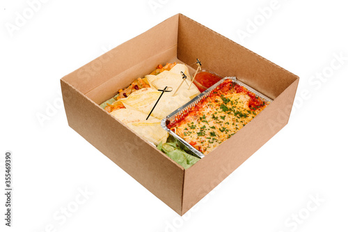 Collection of take away kraft boxes with different food. Set of containers with everyday meals - meat, vegetables and law fat snacks on white background, 