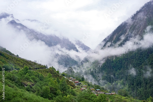 alpine mountain valley landscape with clouds