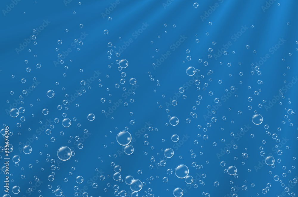 Underwater background with sunbeams and air bubbles.  Texture of water surface.