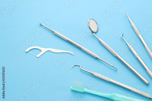 Dental tools on blue background