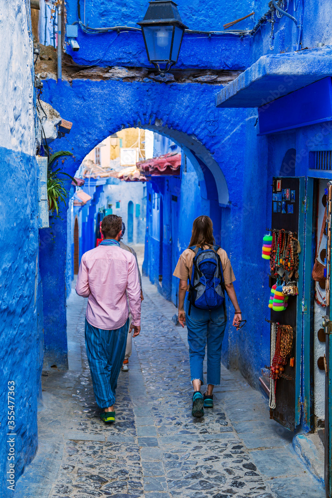 Group of tourists in the famous blue city.