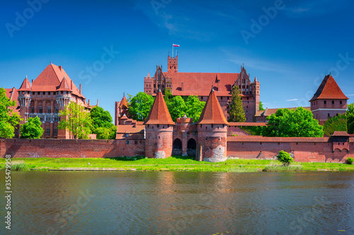 Malbork castle by the Nogat river at summer, Poland
