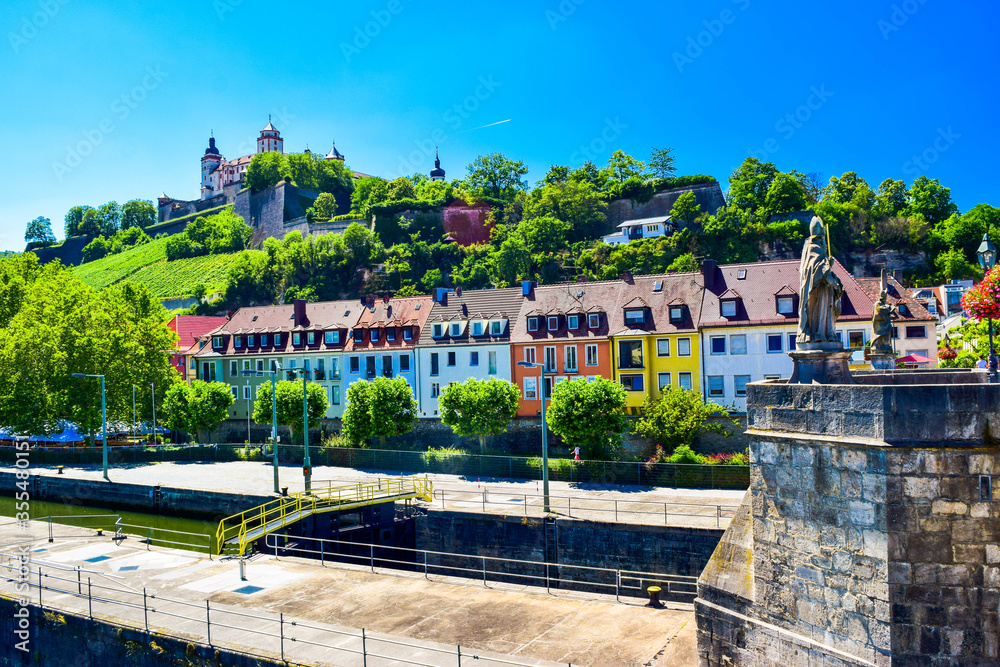 The mighty fortress Marienberg is the symbol of Wurzburg. Festung Marienberg rises above the River Main and vineyards on the hillside. Germany.
