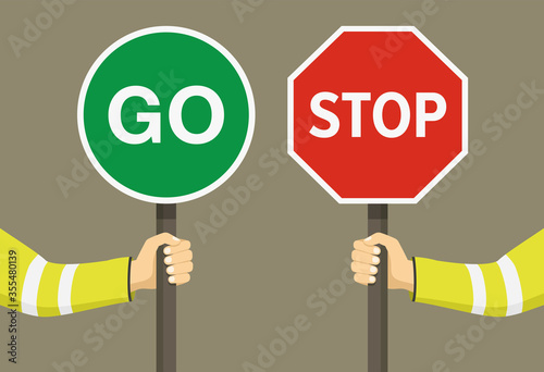 Outdoor worker holding stop and go sign. Hand hold traffic or road sign. Close-up view. Flat vector illustration.