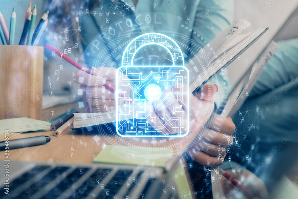 Multi exposure of woman's hands making notes with lock icon. Concept of security and protection of data Multi exposure of woman's hands making notes with lock icon. Concept of security and protection of data