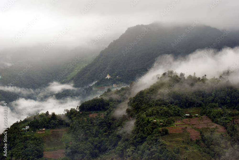 Mist and fog engulfed the verdant green lush Ranka village looks mesmerizing as seen from Gangtok in East Sikkim. Monsoon gives different variety of greenery pictorial views to capture.