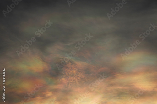 iridescent pileus cloud, multi color overlapping in sky abstract background.