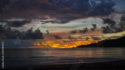 water sea wave hit  sand beach with cloudy sky background at evening sunset time