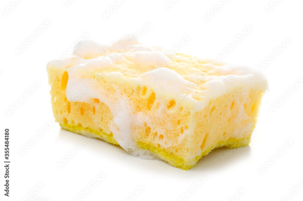 Yellow cleaning sponge in soap foam on white background isolation