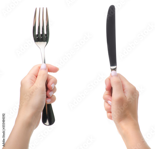 Fork and knife in hands on white background isolation