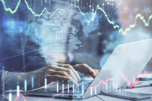 Wallpaper Mural Double exposure of market chart with man working on computer on background. Concept of financial analysis. Torontodigital.ca