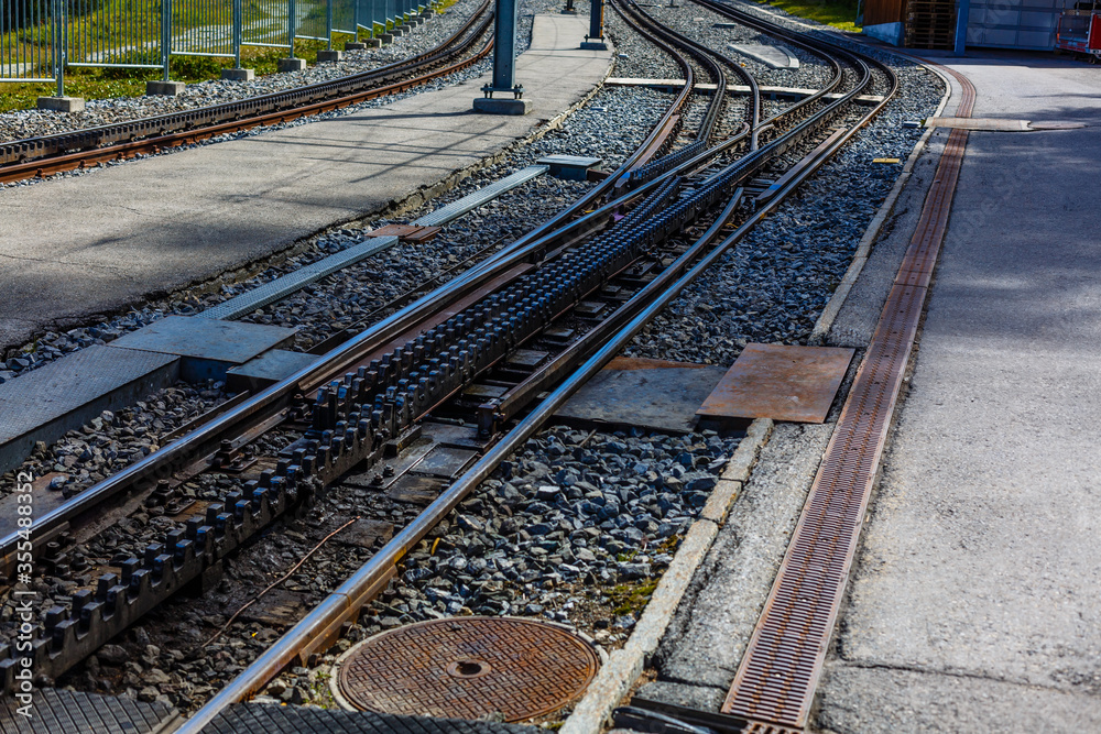 Obraz premium Swiss mountain train crossed Alps, railway in the mountains