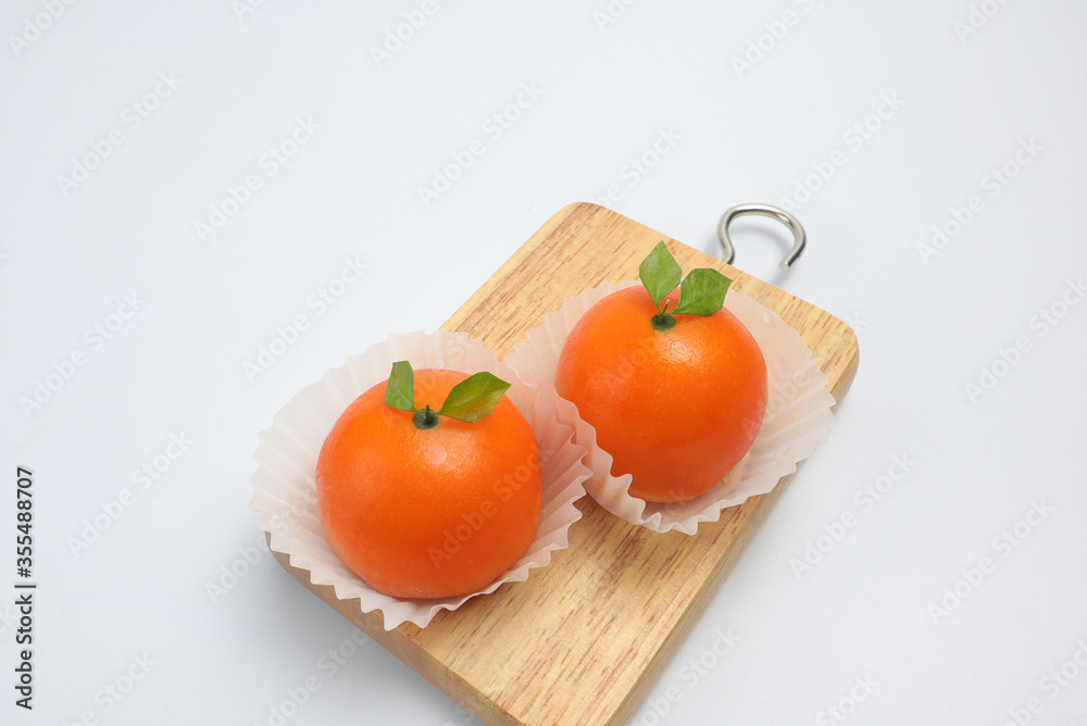 Orange shaped cakes on a white background