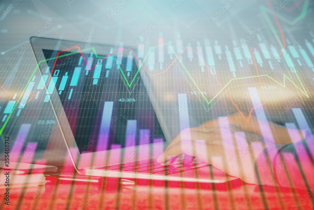 Multi exposure of stock market graph with man working on laptop on background. Concept of financial analysis. Multi exposure of stock market graph with man working on laptop on background. Concept of financial analysis.