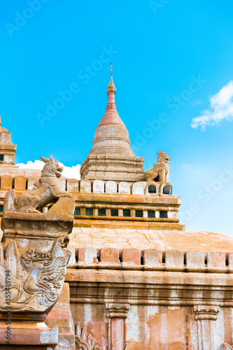 View of the Facade with Skulpures and the Dom of the Ananda Buddhist Temple in Bagan, Myanmar. Copy space for text. Vertical