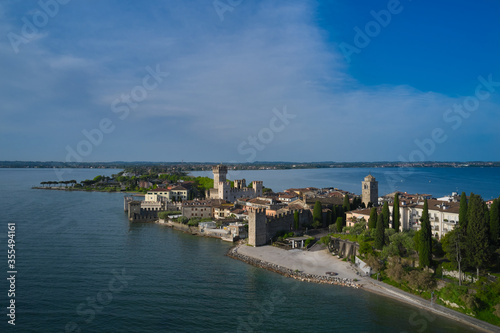 Aerial view of the historical part of Sirmione on the background of Colombare Lake Garda Italy