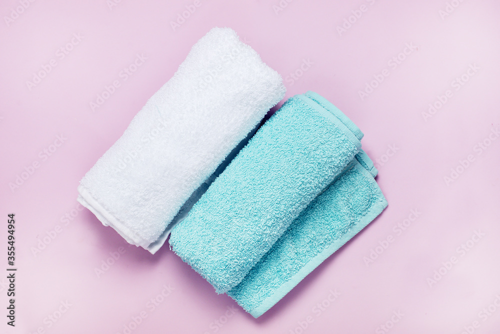 Light Green and White Towels on Pink Background Top View Horizontal Light Green and White Towels on Pink Background Top View Horizontal