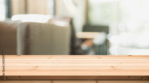 Empty wooden table top on abstract blur background